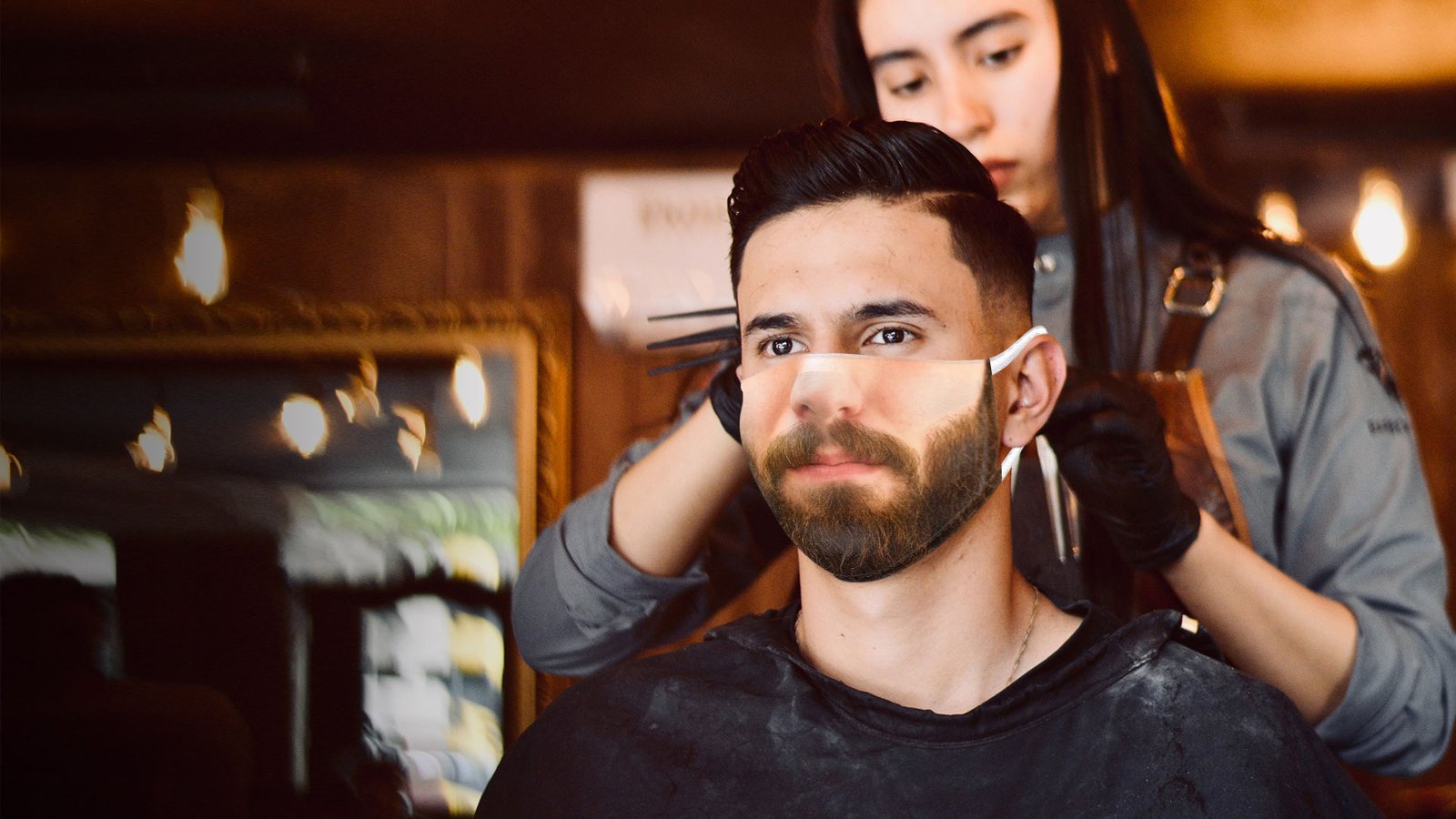 Man wearing a beard face mask at the barbers